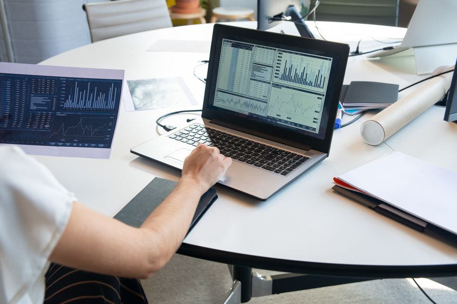 Editor reviewing long-form article data for ai text detector accuracy